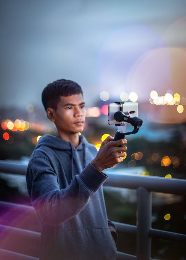 Creator recording a vlog on his phone