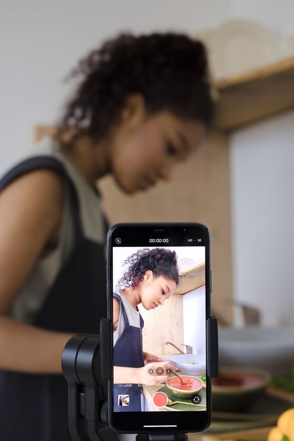Woman filming a cooking video